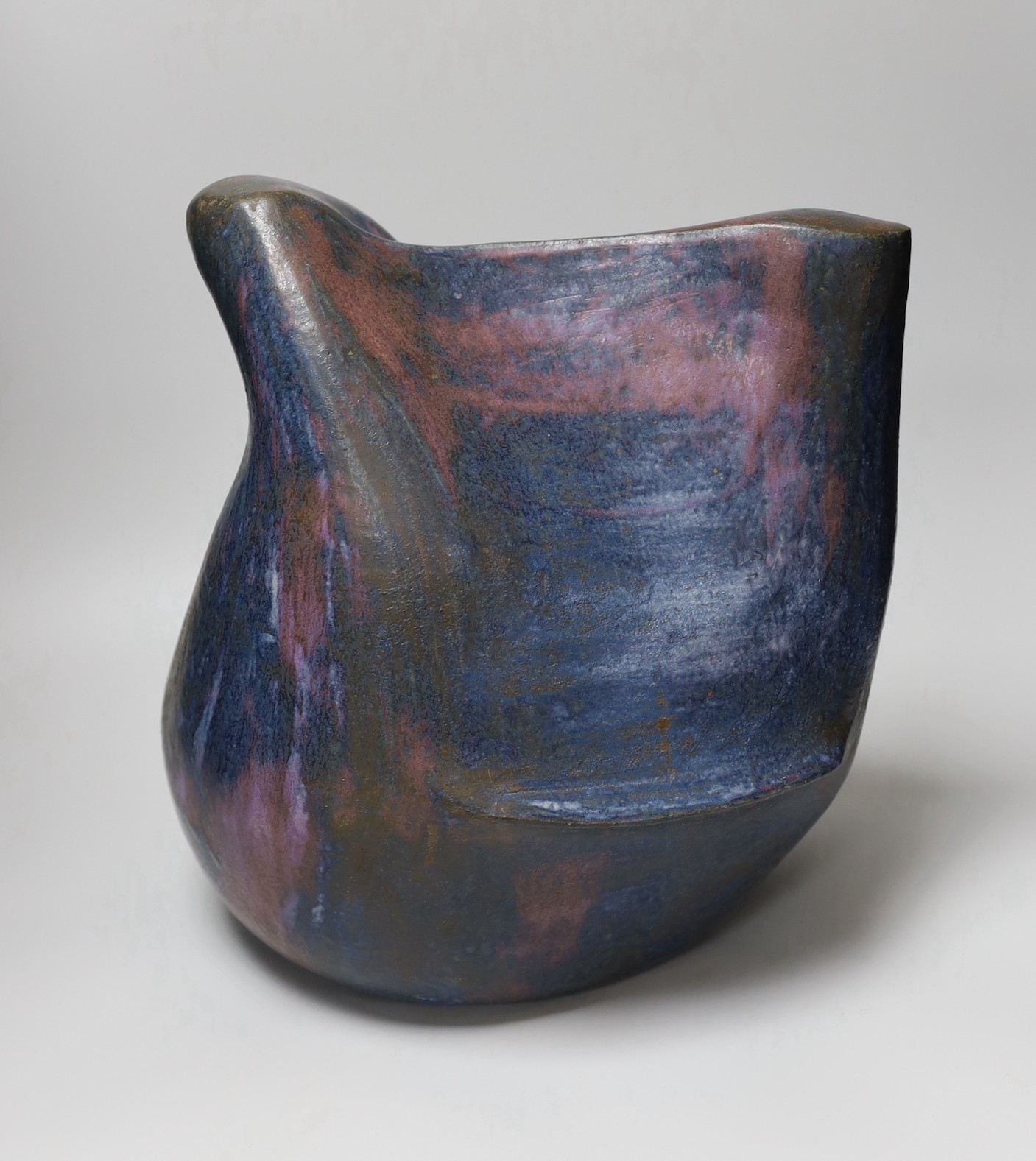 Ruth Sulke - a large studio purple and indigo nickel oxide glazed stoneware bulbous sculpture with flowing lines and hollows, 1985, 34cm, See Sulke, Ruth - Ceramic Sculpture by Ruth Sulke, Hanart 2 Gallery, 1987, page 24